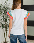 Petals & Poise Floral Flutter Sleeve Top in White